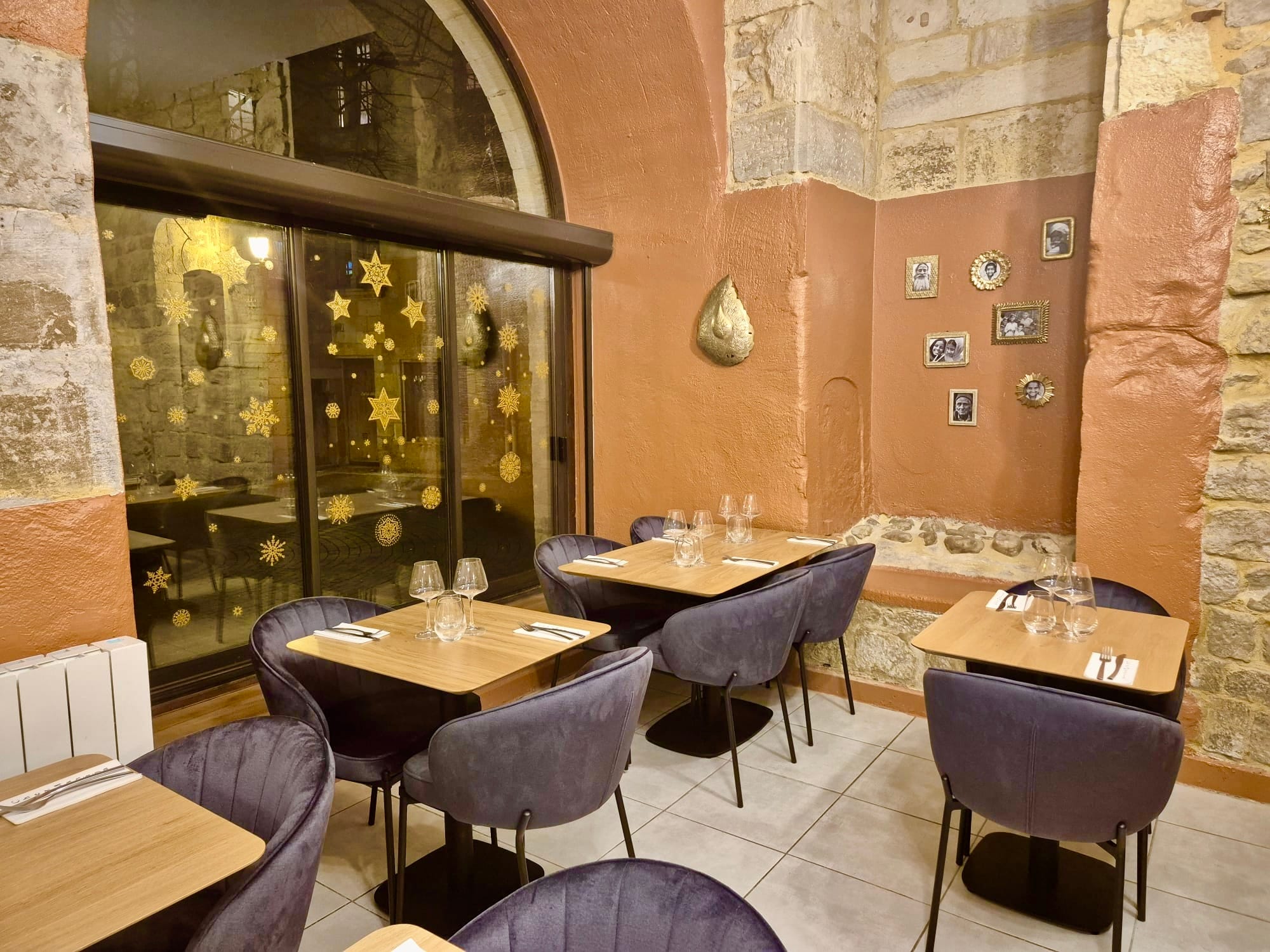 Intimate alcove seating beneath a wall of framed family photographs